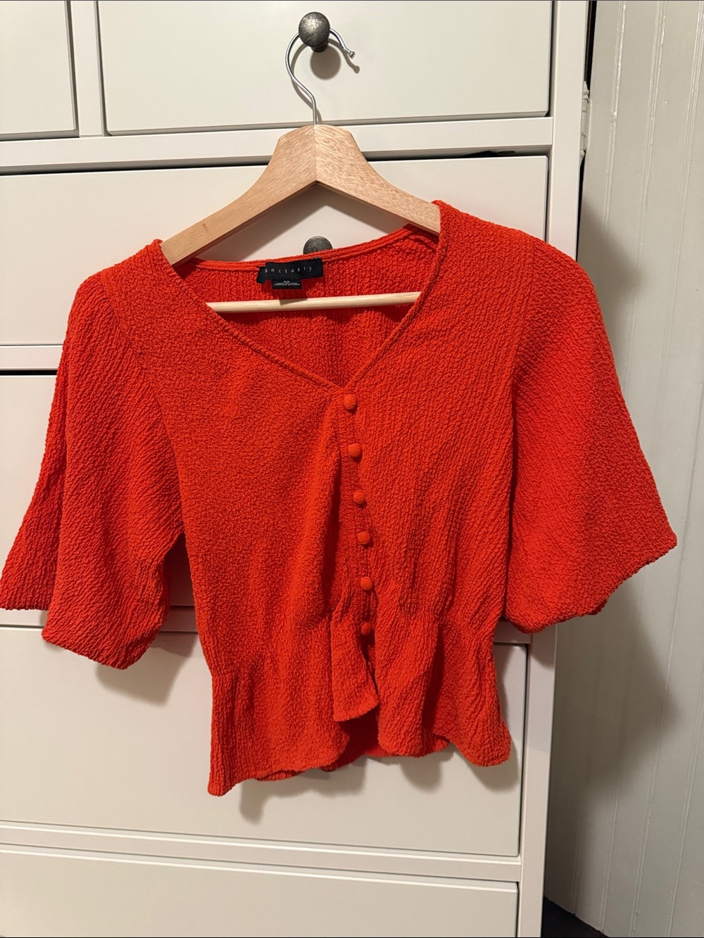 Orange Textured Button-Front Peplum Blouse